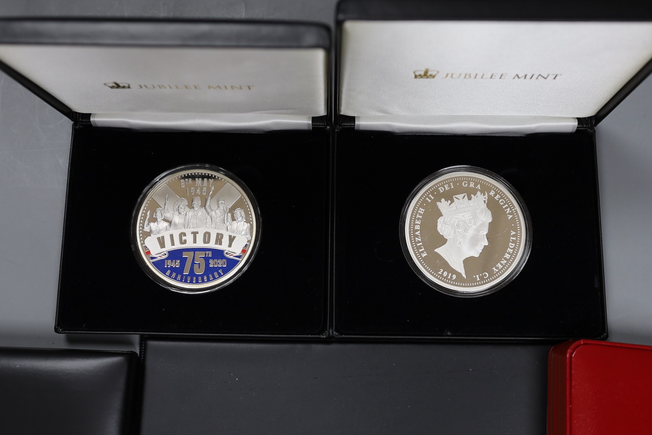 Five assorted silver proof sets.
